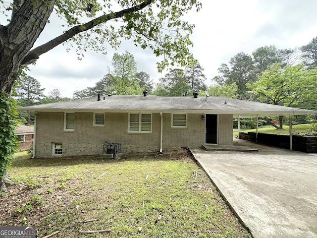 2165 Pemberton Rd, Atlanta, GA 30331 - view of front of home with an attached carport, brick siding, driveway, and a front yard