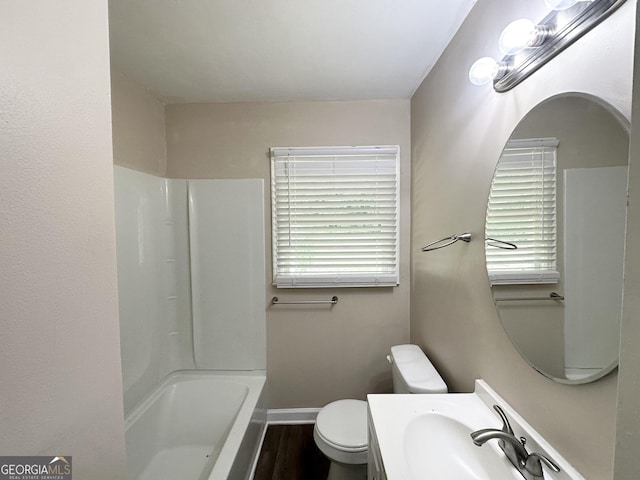 2165 Pemberton Rd, Atlanta, GA 30331 - bathroom with toilet, wood finished floors, baseboards, vanity, and shower / bathtub combination
