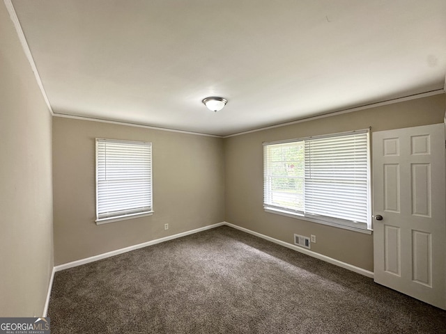 2165 Pemberton Rd, Atlanta, GA 30331 - spare room featuring crown molding, dark colored carpet, and baseboards