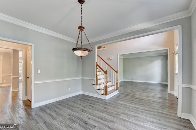 2049 Mclain Rd NW, Acworth, GA 30101 - spare room with stairs, ornamental molding, wood finished floors, and baseboards