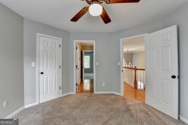 2049 Mclain Rd NW, Acworth, GA 30101 - unfurnished bedroom with carpet floors, a chandelier, and baseboards