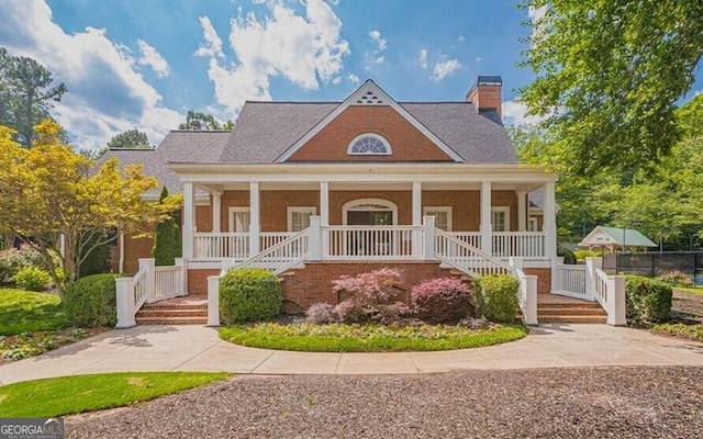 2049 Mclain Rd NW, Acworth, GA 30101 - view of front facade with a porch, a chimney, and stairs
