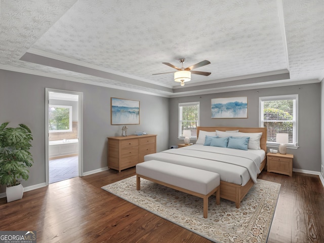 230 Shorewood Ct, Mcdonough, GA 30252 - bedroom with a raised ceiling, baseboards, hardwood / wood-style floors, ornamental molding, and a textured ceiling