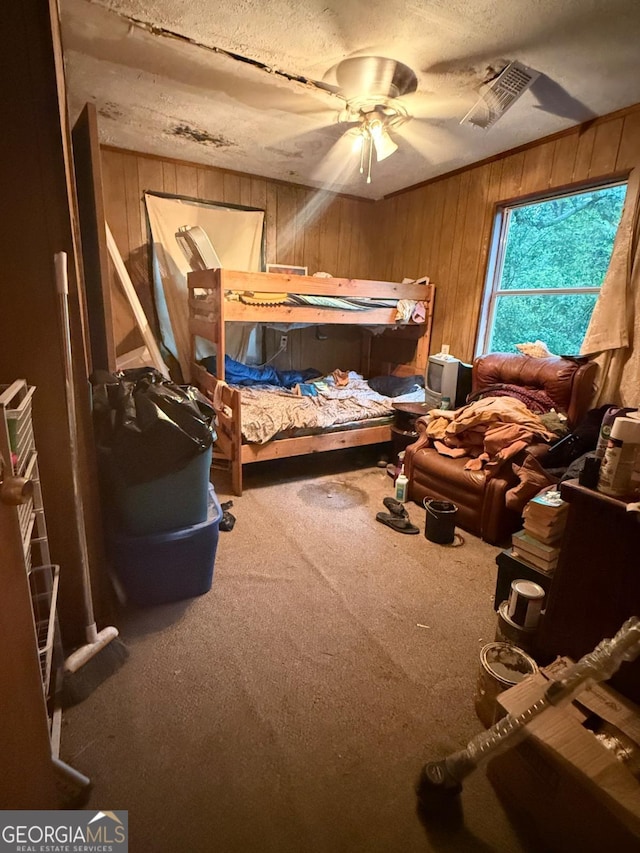3448 Orchard Cir, Decatur, GA 30032 - bedroom with carpet flooring, wooden walls, a textured ceiling, and a ceiling fan