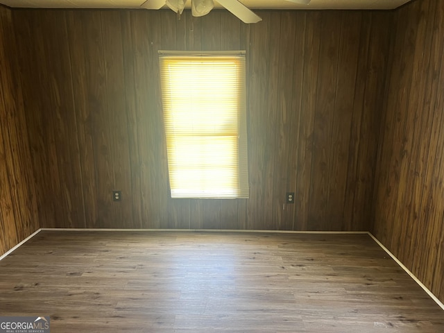 491 Cavender Creek Rd, Carrollton, GA 30116 - unfurnished room with wood finished floors, ceiling fan, and wood walls
