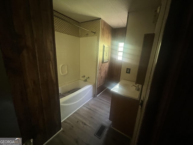 491 Cavender Creek Rd, Carrollton, GA 30116 - bathroom with wood finished floors,  shower combination, and vanity