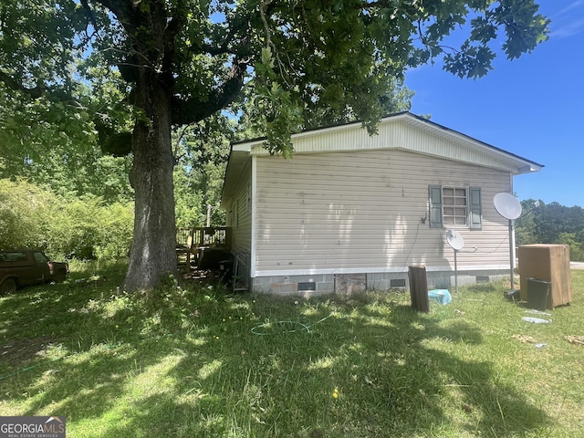 491 Cavender Creek Rd, Carrollton, GA 30116 - view of home's exterior with crawl space and a lawn