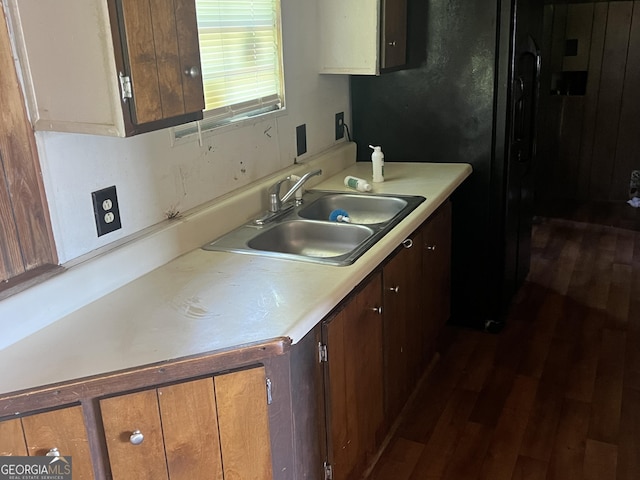 491 Cavender Creek Rd, Carrollton, GA 30116 - kitchen featuring a sink, light countertops, and dark wood finished floors