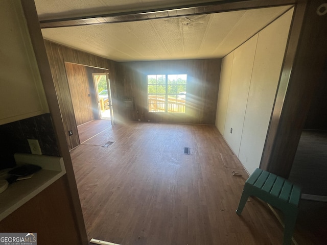 491 Cavender Creek Rd, Carrollton, GA 30116 - unfurnished dining area featuring wood finished floors and wood walls