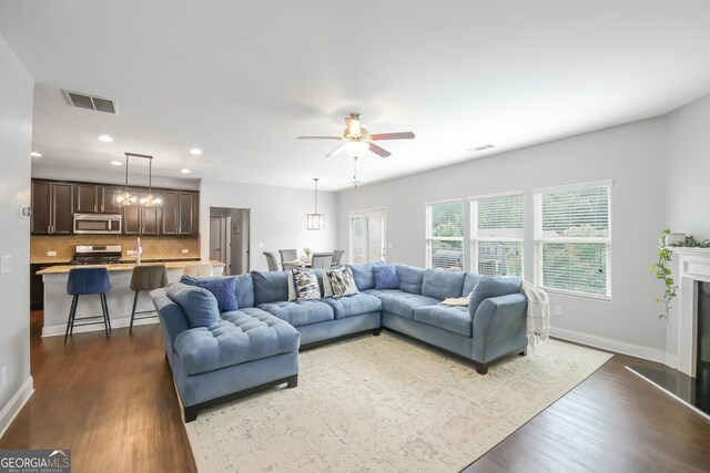 1720 Grant Ct, Braselton, GA 30517 - living area with dark wood-type flooring, ceiling fan, recessed lighting, baseboards, and a fireplace