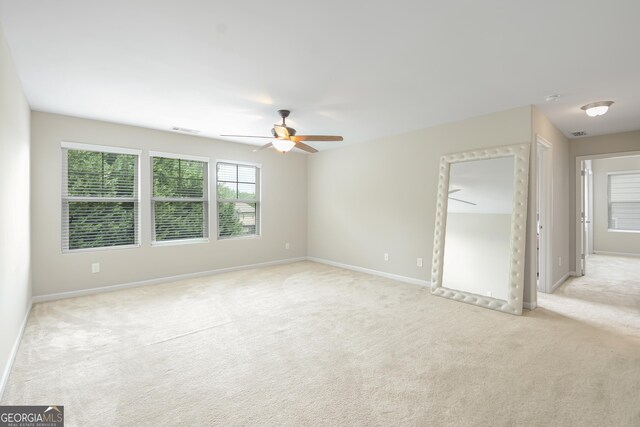 1720 Grant Ct, Braselton, GA 30517 - empty room featuring light colored carpet, ceiling fan, and baseboards