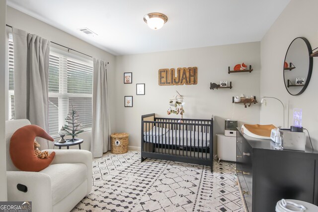 1720 Grant Ct, Braselton, GA 30517 - bedroom with a nursery area and baseboards
