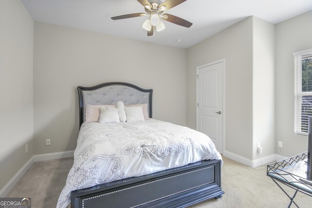 1720 Grant Ct, Braselton, GA 30517 - carpeted bedroom with baseboards and ceiling fan