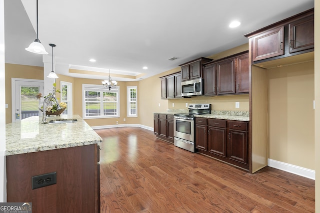 114 Brookstone Dr, Carrollton, GA 30116 - kitchen with appliances with stainless steel finishes, a sink, a chandelier, dark wood-type flooring, and recessed lighting