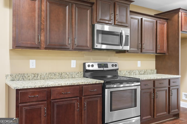 114 Brookstone Dr, Carrollton, GA 30116 - kitchen with stainless steel appliances and light stone countertops