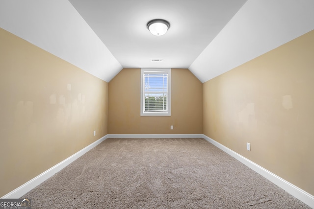 114 Brookstone Dr, Carrollton, GA 30116 - additional living space with carpet flooring, baseboards, and vaulted ceiling