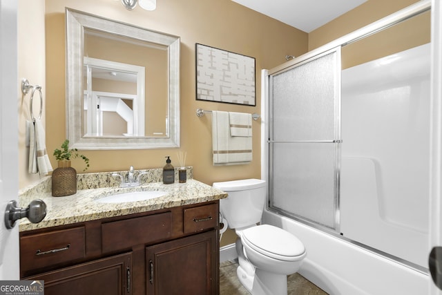 114 Brookstone Dr, Carrollton, GA 30116 - full bathroom with toilet, vanity, combined bath / shower with glass door, and baseboards