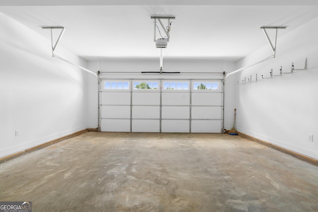 114 Brookstone Dr, Carrollton, GA 30116 - garage featuring a garage door opener and baseboards