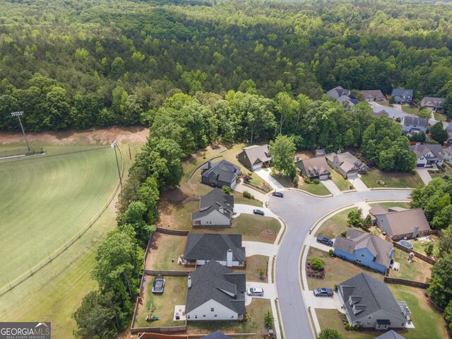 114 Brookstone Dr, Carrollton, GA 30116 - aerial view of property's location featuring a heavily wooded area and nearby suburban area