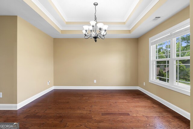 114 Brookstone Dr, Carrollton, GA 30116 - unfurnished room featuring a tray ceiling, a chandelier, crown molding, dark wood-style floors, and baseboards