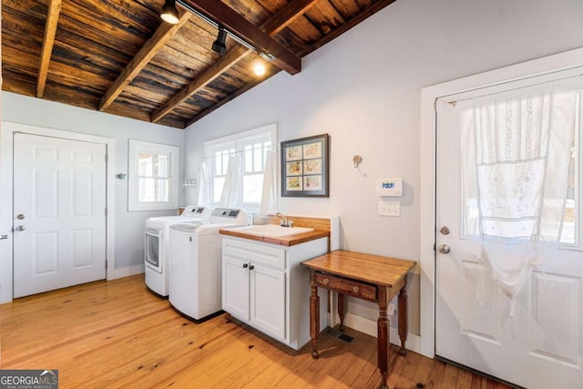 527 Main St, Suwanee, GA 30024 - laundry area featuring wood ceiling, independent washer and dryer, light wood-style flooring, cabinet space, and baseboards
