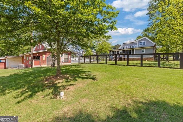 527 Main St, Suwanee, GA 30024 - view of yard featuring central AC unit and a barn