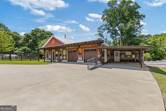 527 Main St, Suwanee, GA 30024 - view of front of home featuring driveway, an attached garage, and a carport