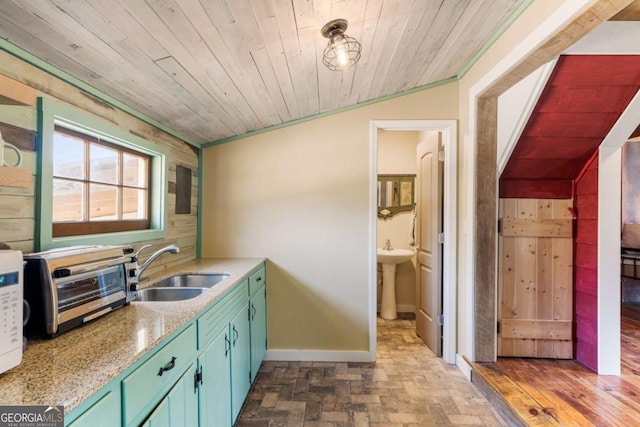 527 Main St, Suwanee, GA 30024 - kitchen featuring a sink, brick patterned floors, baseboards, wood ceiling, and ornamental molding
