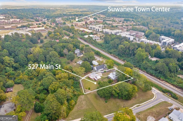 527 Main St, Suwanee, GA 30024 - aerial view of property and surrounding area featuring property parcel outlined