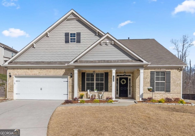 7995 Brewton Creek Dr, Cumming, GA 30028 - craftsman-style home featuring a porch, brick siding, driveway, and a front yard