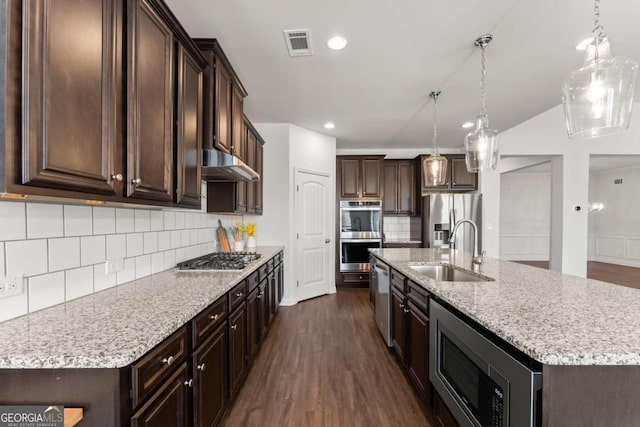 7995 Brewton Creek Dr, Cumming, GA 30028 - kitchen featuring a sink, appliances with stainless steel finishes, under cabinet range hood, dark brown cabinets, and tasteful backsplash