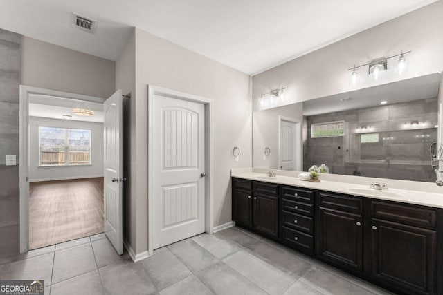 7995 Brewton Creek Dr, Cumming, GA 30028 - full bathroom with plenty of natural light, double vanity, tile patterned floors, and a tile shower