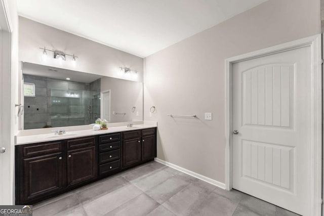 7995 Brewton Creek Dr, Cumming, GA 30028 - full bathroom featuring a shower stall, double vanity, baseboards, and tile patterned floors