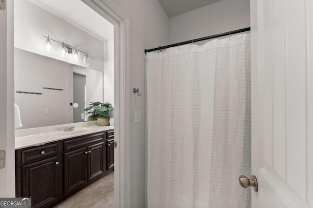 7995 Brewton Creek Dr, Cumming, GA 30028 - bathroom featuring vanity, rail lighting, tile patterned floors, and a shower with curtain