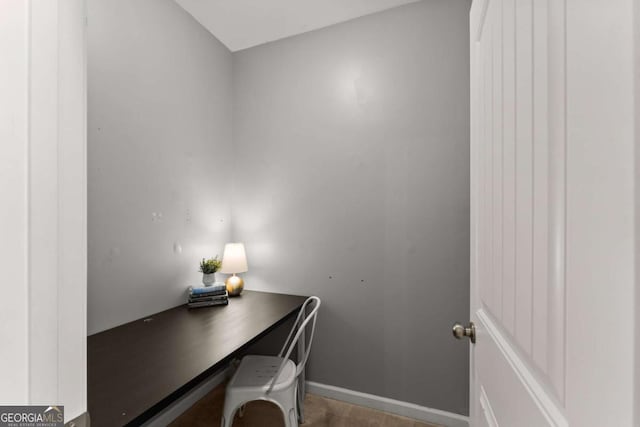 7995 Brewton Creek Dr, Cumming, GA 30028 - home office featuring baseboards and built in desk