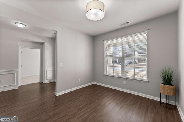 7995 Brewton Creek Dr, Cumming, GA 30028 - spare room featuring dark wood-style floors and baseboards