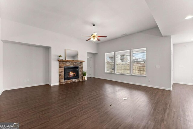 7995 Brewton Creek Dr, Cumming, GA 30028 - unfurnished living room featuring dark wood-style floors, a ceiling fan, a fireplace, baseboards, and recessed lighting