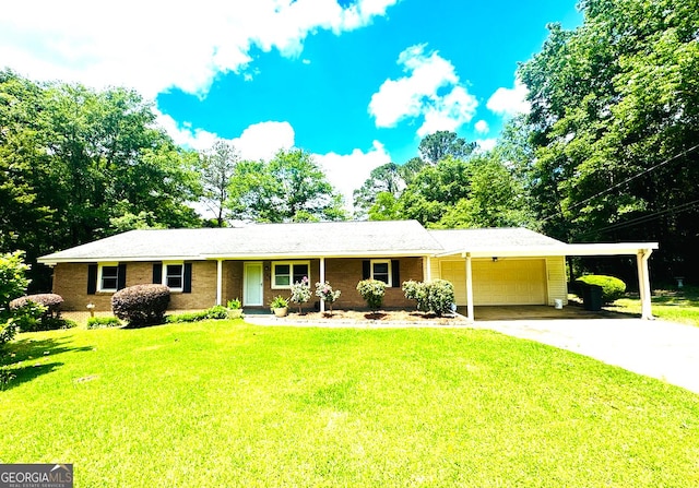 ranch-style home with driveway, a carport, an attached garage, and a front yard