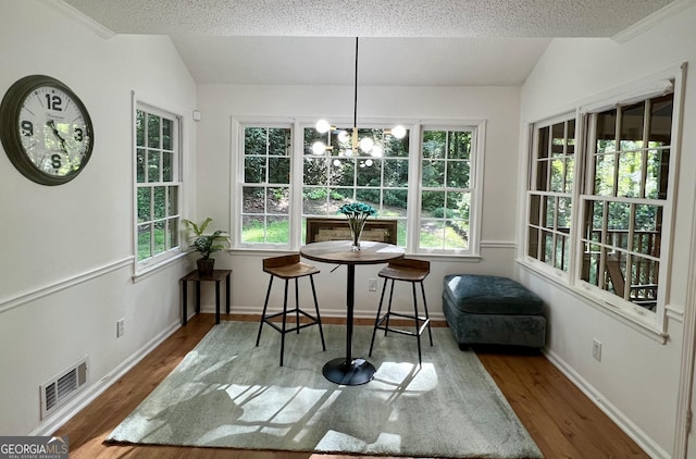 1461 Fox Forest Ter SW, Lilburn, GA 30047 - sunroom featuring a chandelier, healthy amount of natural light, and lofted ceiling
