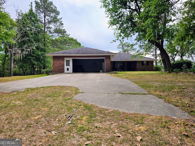 3978 Wc Hodges Rd, Statesboro, GA 30461 - ranch-style house with driveway, a garage, brick siding, and a front lawn