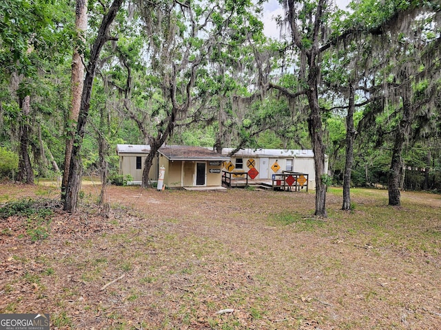 3978 Wc Hodges Rd, Statesboro, GA 30461 - view of yard with a wooden deck and an outbuilding