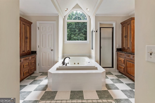 bathroom with a shower stall, a whirlpool tub, vanity, and lofted ceiling