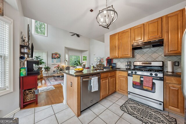200 Valley Xing, Canton, GA 30114 - kitchen featuring appliances with stainless steel finishes, under cabinet range hood, backsplash, a peninsula, and a sink
