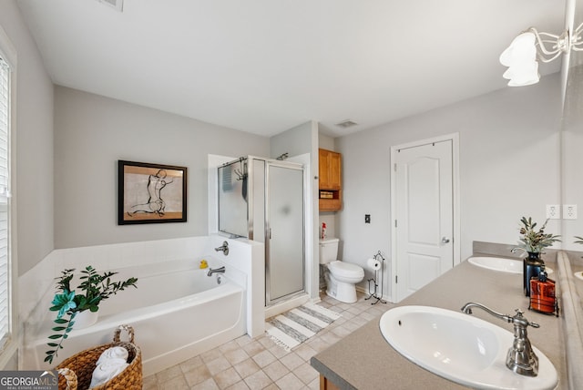 bathroom featuring toilet, a stall shower, a garden tub, tile patterned flooring, and double vanity