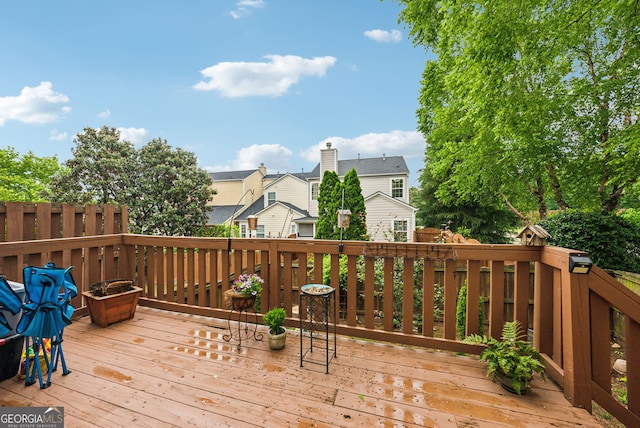 wooden deck featuring a residential view