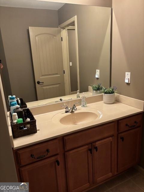 bathroom with vanity and tile patterned floors