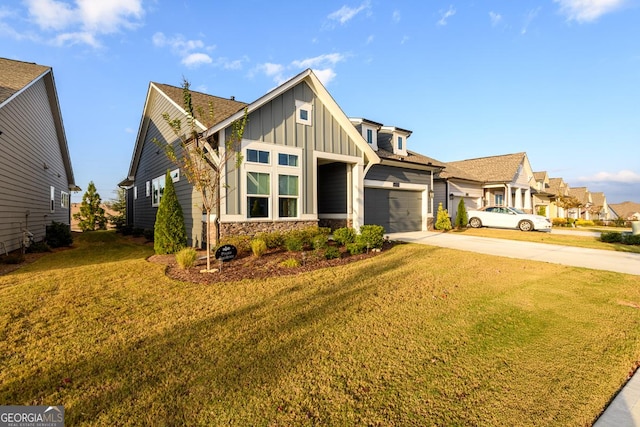 6821 Bungalow Rd, Flowery Branch, GA 30542 - view of front of home with board and batten siding, driveway, a front lawn, stone siding, and an attached garage