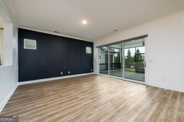 6821 Bungalow Rd, Flowery Branch, GA 30542 - empty room with ornamental molding, wood finished floors, and baseboards