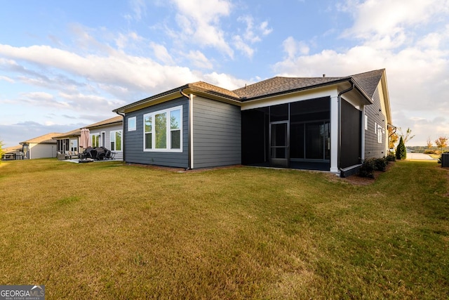 6821 Bungalow Rd, Flowery Branch, GA 30542 - rear view of house with a sunroom and a yard