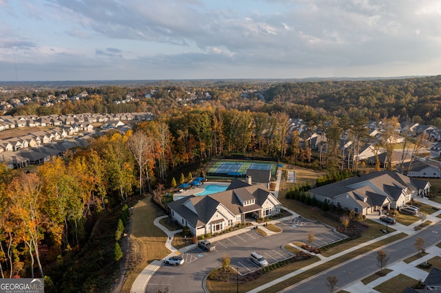 6821 Bungalow Rd, Flowery Branch, GA 30542 - aerial view of property and surrounding area featuring a pool, nearby suburban area, and a heavily wooded area